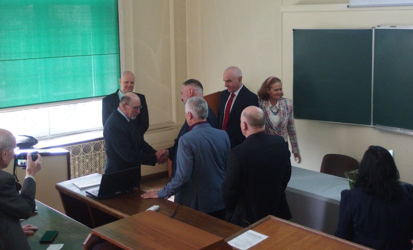 Dr. Stanislaw Pruś receives congratulations after defending his doctorate 