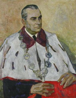 Obraz olejny. Portret czwartego rektora PŁ. prof. Mieczysława Klimka , który pozuje w todze i łańcuchu.