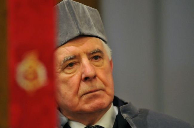 Portrait photo: Prof. Tadeusz Kaczorek in grey gown at the ceremony of awarding the DHC title of TUL.