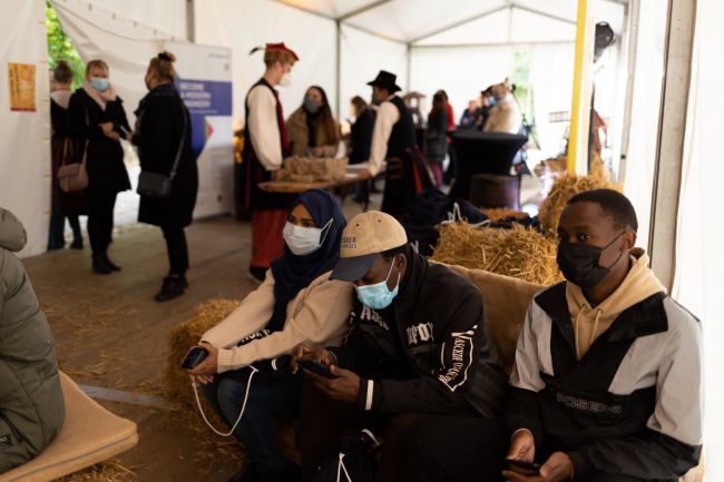 Studentr in a specially decorated tent pavilion