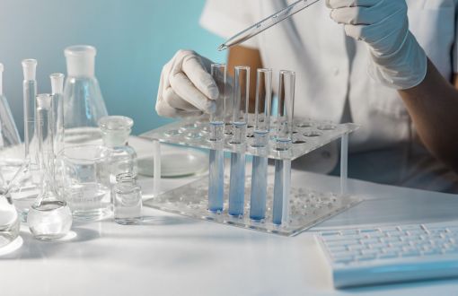 White laboratory table with transparent test tubes.