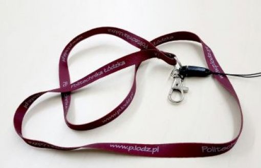 Fabric lanyard in maroon finished with a metal clasp on a light background.