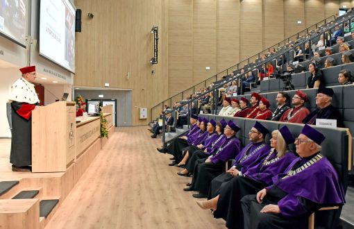 The rector addresses a full house